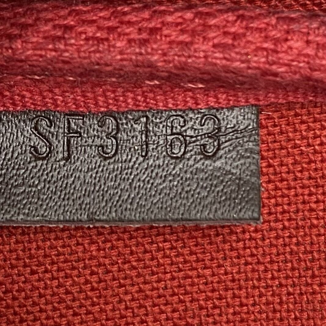 Bolsa Louis Vuitton Mini Pochette Accessoires Damier Ebene